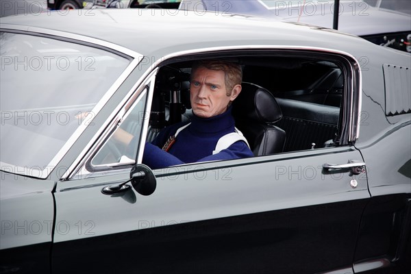 Steve McQueen model or mannequin in a Ford Mustang GT (the Bullitt film car).