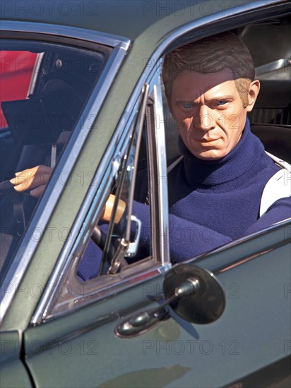 At a classic car rally in Brighton sits a model of the actor Steve McQueen as seen in the film Bullitt