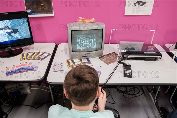 pac-man  computer game on old monitor in the retro area at gamescom , worldâ€™s largest trade fair for computer and video games in Cologne, Germany on  August 21, 2019