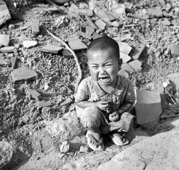 On Monday, August 6, 1945, at 8:15 am, the nuclear bomb 'Little Boy' was dropped on Hiroshima by an American B-29 bomber, the Enola Gay, directly killing an estimated 80,000 people.
By the end of the year, injury and radiation brought the total number of deaths to 90,000–166,000. The population before the bombing was around 340,000 to 350,000. Approximately 70% of the city's buildings were destroyed, and another 7% severely damaged.