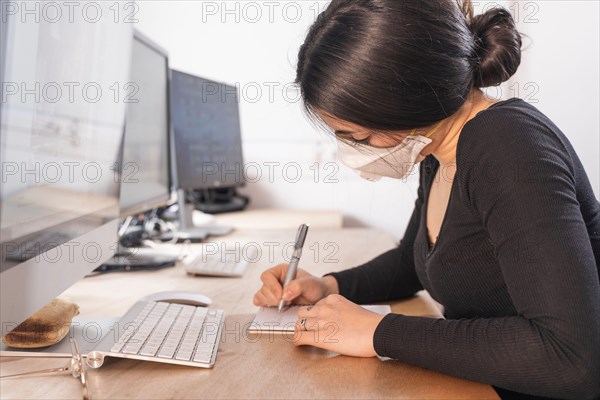 Coronavirus. Woman at the office sick with mask for corona virus. Business women wear masks to protect and take care of their health. Home working