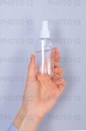 COVID-19 Pandemic Coronavirus. Close up woman hands using hands sanitizer alcohol gel dispenser, against 2019-nCoV. Antiseptic, Hygiene and Healthcare