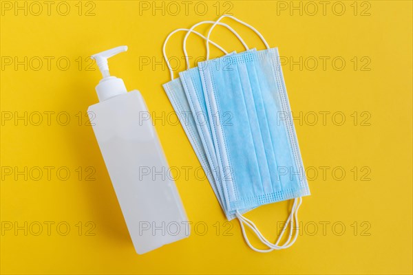 Hand Sanitizer and 3 layer surgical mask - Corona Virus Covid 19 concept - Health and care.