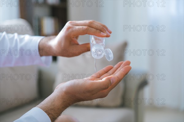 Cleaning and disinfection of hands with hand sanitizer gel for Stopping the spread of Covid-19, 2019-nCoV or Coronavirus. Disinfecting hands to clean