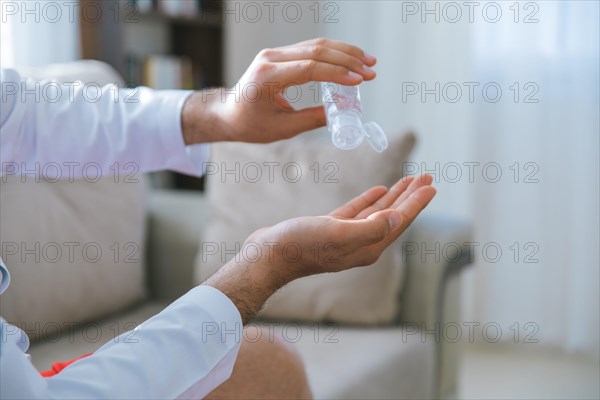 Cleaning and disinfection of hands with hand sanitizer gel for Stopping the spread of Covid-19, 2019-nCoV or Coronavirus. Disinfecting hands to clean