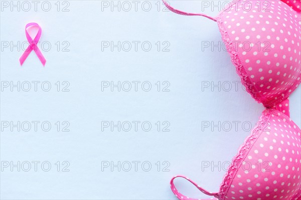 pink ribbon breast cancer symbol and bra mockup