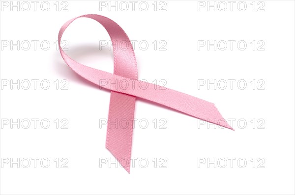 Pink ribbon signifying breast cancer symbol on white background