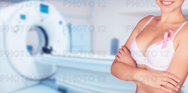 Breast cancer prevention concept. Background of female breasts in a bra in the office of mammography.