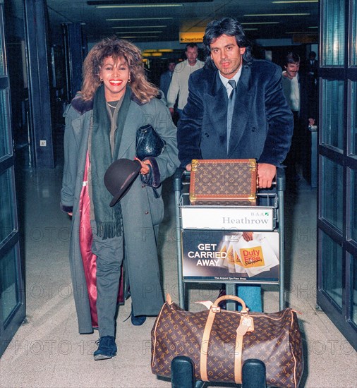 American born rock singer Tina Turner arriving at London's Heathrow Airport with boyfriend Erwin Bach in September 1989