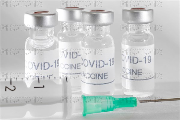 Covid-19 vaccine vials. Coronavirus pandemic infection. Global prevention vaccination