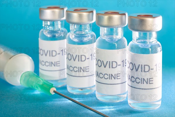 Covid-19 vaccine vials. Coronavirus pandemic infection. Global prevention vaccination