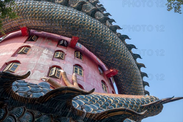 Nakhon Pathom, Thailand-February, 2020:Wat Samphran Dragon Temple in the Sam Phran District.Buddhist temple has a dragon wrapped around it.