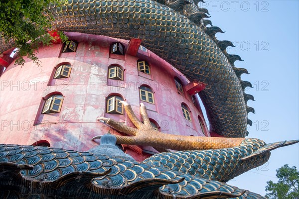 Nakhon Pathom, Thailand-February, 2020:Wat Samphran Dragon Temple in the Sam Phran District.Buddhist temple has a dragon wrapped around it.