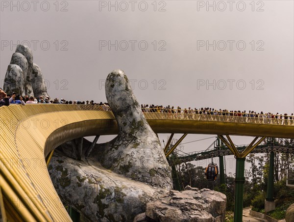 Ba Na Hills, Danang/Vietnam-02/25/2019: the newly opened Golden Bridge supported by a pair of giant hands at the summit of Ba Na Hills