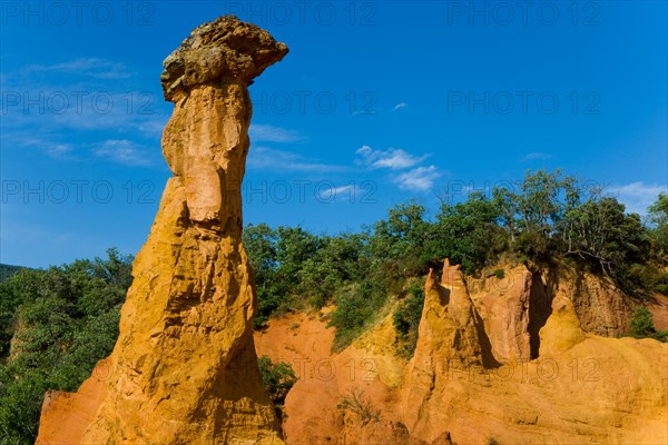 Rustrel France Provence Vaucluse sienna rock ocher erosion cliff sculptures cliff pillars trees wood forest,