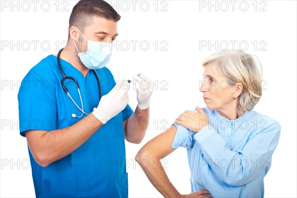 Doctor man with mask preparing syringe for vaccination senior patient isolated on white background