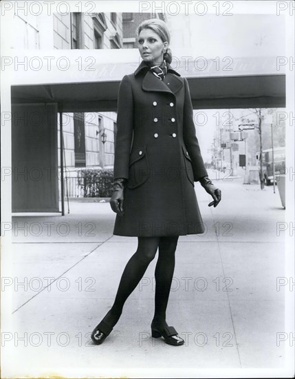Jun. 15, 1969 - The little coat is still big news for Fall '69 from Originala, a brown double buttoned coat with lots of shaping has a regency collar and slanted patch pockets shoes by Pierre Cardin Magic Fit panti hose by Trimfit.