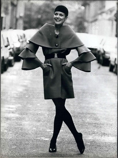 Aug. 04, 1982 - Here is a belted coat by Pierre Cardin with an original neckline. It is from his 1982-3 haute-couture fall and winter collection.