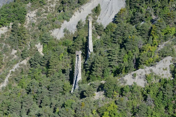HOODOOS (aerial view). Pinnacles in a forest, near the village of Théus, Hautes-Alpes, France.