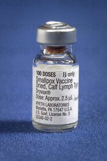A vial of Dryvax{R} dried calf lymph type smallpox vaccine, which is reconstituted with a diluent prior to vaccination, 2002. Vaccinia (smallpox) vaccine, derived from calf lymph, and currently licensed in the United States, is a lyophilized, live-virus preparation of infectious vaccinia virus. It does not contain smallpox (variola) virus. Image courtesy CDC.