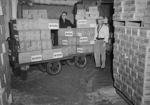 Two workers stand beside a cart loaded with boxes containing poliovirus vaccine, 1963. In the early 1950's, there were more than 20, 000 cases of polio each year. After polio vaccination began in 1955, cases dropped significantly. By 1960, the number of cases dropped to about 3, 000, and by 1979 there were only about 10. Image courtesy CDC/Mr. Stafford Smith.