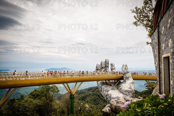 The Golden Bridge /Vietnamese: C?u Vàng) is a pedestrian bridge located in the Sun World resort in Bà Nà Hills near Da Nang in Vietnam.