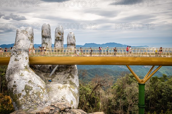 The Golden Bridge /Vietnamese: C?u Vàng) is a pedestrian bridge located in the Sun World resort in Bà Nà Hills near Da Nang in Vietnam.