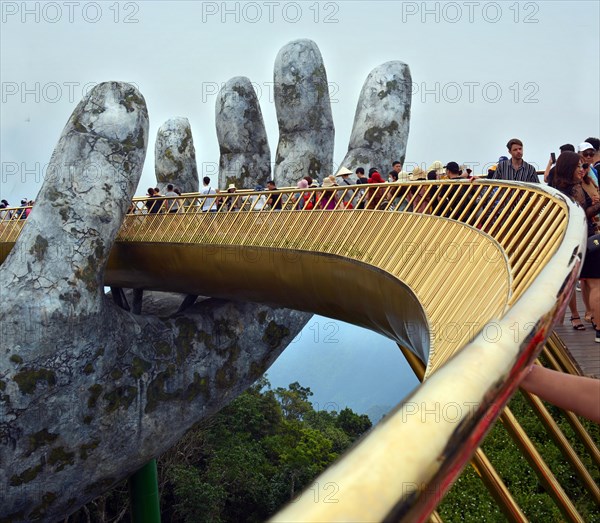 Ba Na, Vietnam - June 06, 2019; The Golden Hand Bridge at Ba Na in the central highlands of Vietnam.
