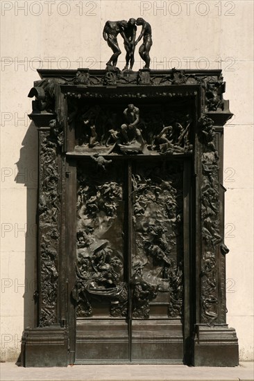 The Gates of Hell (La Porte de l'Enfer) by French sculptor Auguste Rodin seen in the garden of The Musee Rodin in Paris, France.