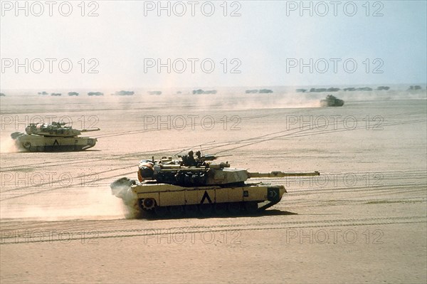 A US Army M-1A1 Abrams main battle tank from the 3rd Armored Division, moves across the desert into Kuwait during Operation Desert Storm February 15, 1991 in Kuwait.