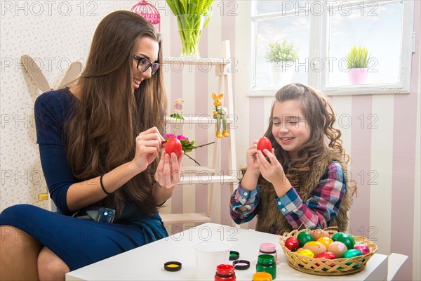 Easter - Mother and daughter painted with egg