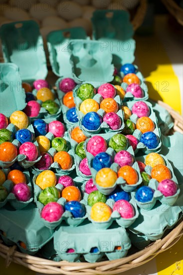 Colorful marble Easter eggs for sale at outdoor market, Paris, France