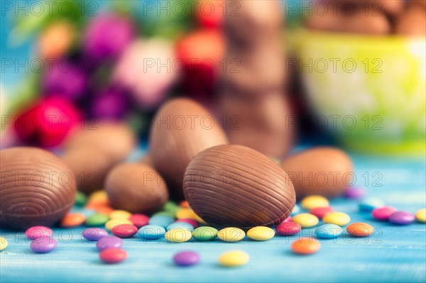 Easter chocolate rabbit, eggs and tulips. Spring theme.