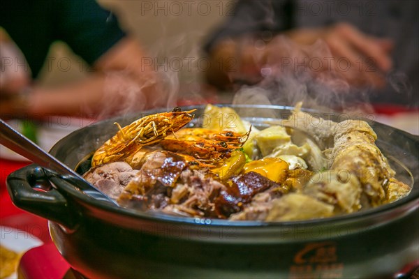 Traditional Chinese New Year Dish served in hot claypot