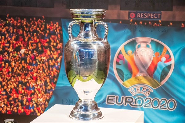 Original UEFA European Championship Trophy with stadium background and logo EURO 2020