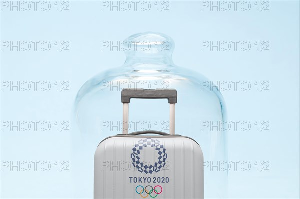 Belgrade, Serbia - 19th April 2020": suitcase with Tokyo 2020 Olympic rings in quarantine, coronavirus and travel restrictions concept.