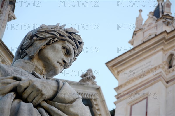 The statue of Dante Alighieri, author of the Divine Comedy, in front of the Basilica of Santa Croce in the heart of Florence.