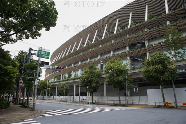 Tokyo, Japan. 21st July, 2020. Japan National Stadium in Shinjuku City which will be use for the Olympic Games Tokyo 2021.Due to the Covid-19 outbreak, the Olympic Games Tokyo 2020 were postponed for the first time in history. The Opening Ceremony of the Olympic Games Tokyo 2020 will now be held on 23rd July 2021 instead of 24 July 2020. Credit: SOPA Images Limited/Alamy Live News