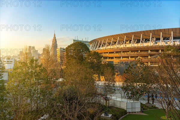 tokyo, japan - february 8 2021: High angle sunset view of the 2020 Olympic national stadium in front of the  japan sport olympic square with the NTT D