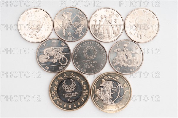 Tokyo, Japan - January 4, 2021: Commemorative coins of 100 yen and 500 yen for the Tokyo 2020 Olympic Games.