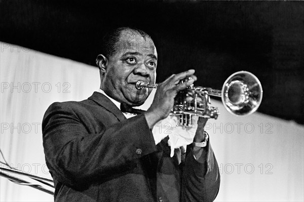Louis Armstrong or Satchmo as he was known, the world's greatest trumpeter. Born on the 4 July