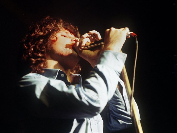 An undated file picture shows 'The Doors' singer Jim Morrison during a concert. Jim Morrison is supposed to be pardoned from the accusal of having denuded in public during a concert, by the parting gouvenor of Florida, Crist. Morrison, who died in July 1971, was sentenced to a 500 Dollar fee and six months in custody. The case will be decided on on Tuesday 7 December 2010. Photo: d
