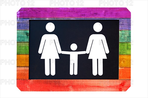 Lesbian family with child white sign on a blackboard, rainbow gay flag colors