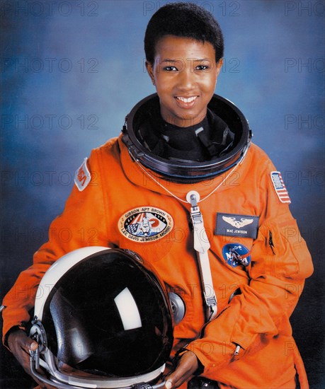 Official portrait of NASA STS-47 Spacelab-J Space Shuttle Endeavour mission prime crew astronaut Dr. Mae Jemison in an orange spacesuit at the Johnson Space Center July 1, 1992 in Houston, Texas. Jamison was the first African-American woman in space.   (photo by NASA Photo via Planetpix)