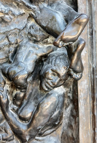 Paris - Museum Rodin. The Gates of Hell is a monumental sculptural group work by Rodin that depicts a scene from "The Inferno",  Dante Alighieri's Div