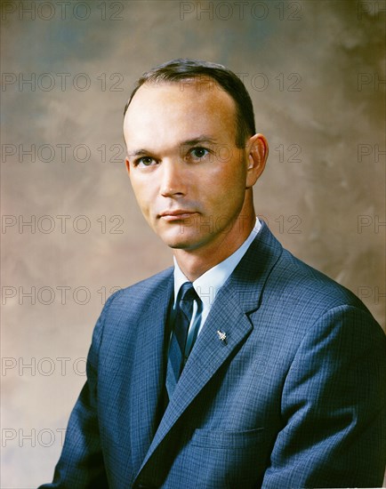 Portrait of astronaut Michael Collins in a business suit.