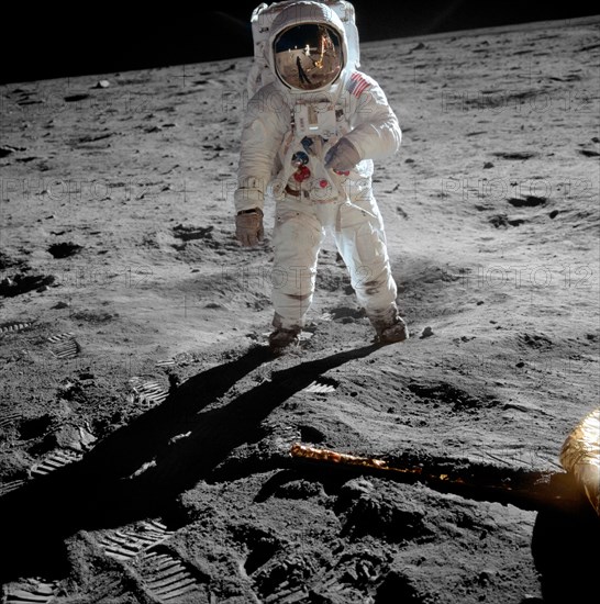 Astronaut Buzz Aldrin on the moon - Astronaut Buzz Aldrin, lunar module pilot, stands on the surface of the moon near the leg of the lunar module, Eagle, during the Apollo 11 moonwalk. Astronaut Neil Armstrong, mission commander, took this photograph with a 70mm lunar surface camera. While Armstrong and Aldrin descended in the lunar module to explore the Sea of Tranquility, astronaut Michael Collins, command module pilot, remained in lunar orbit with the Command and Service Module, Columbia. July 1969