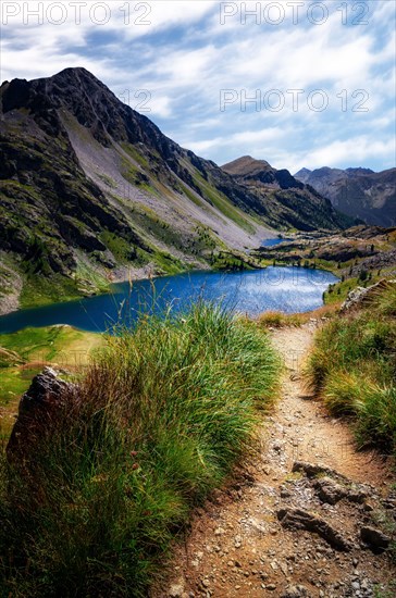Mountain path to the Lac Superieur de Vens, or Upper Lake of Vens in National Park of Mercantour (France)