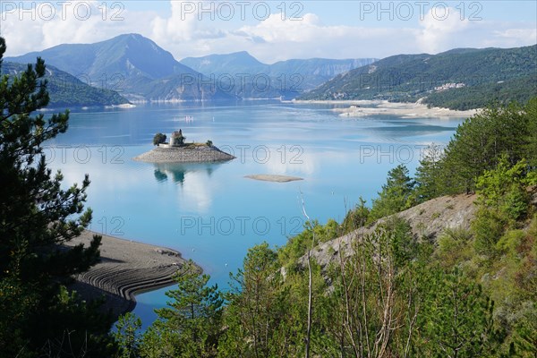 panoramic view of the bay st michel on serre ponçon lake, france