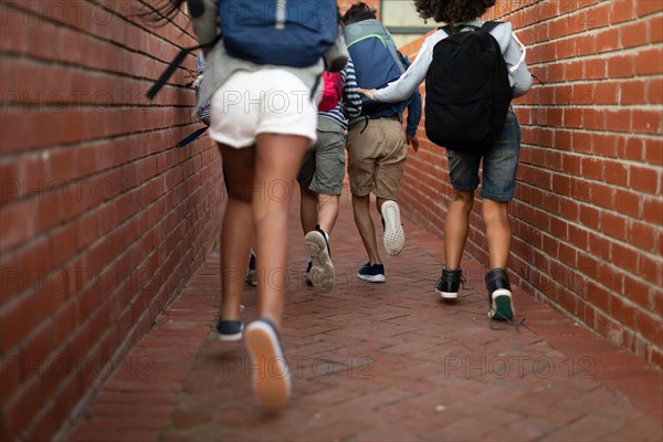 Low section of group of kids running